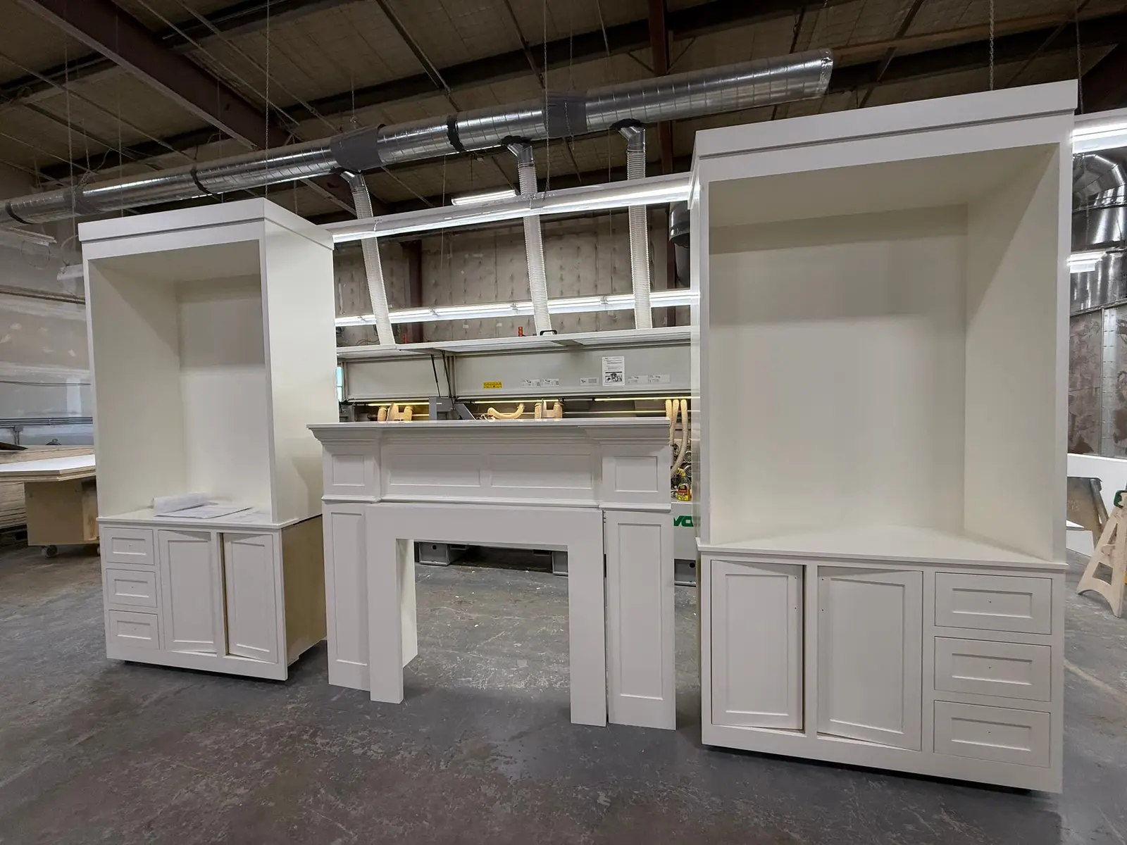 Custom painted built-in cabinets and fireplace surround for a home in Dieppe, NB by Hempston Home